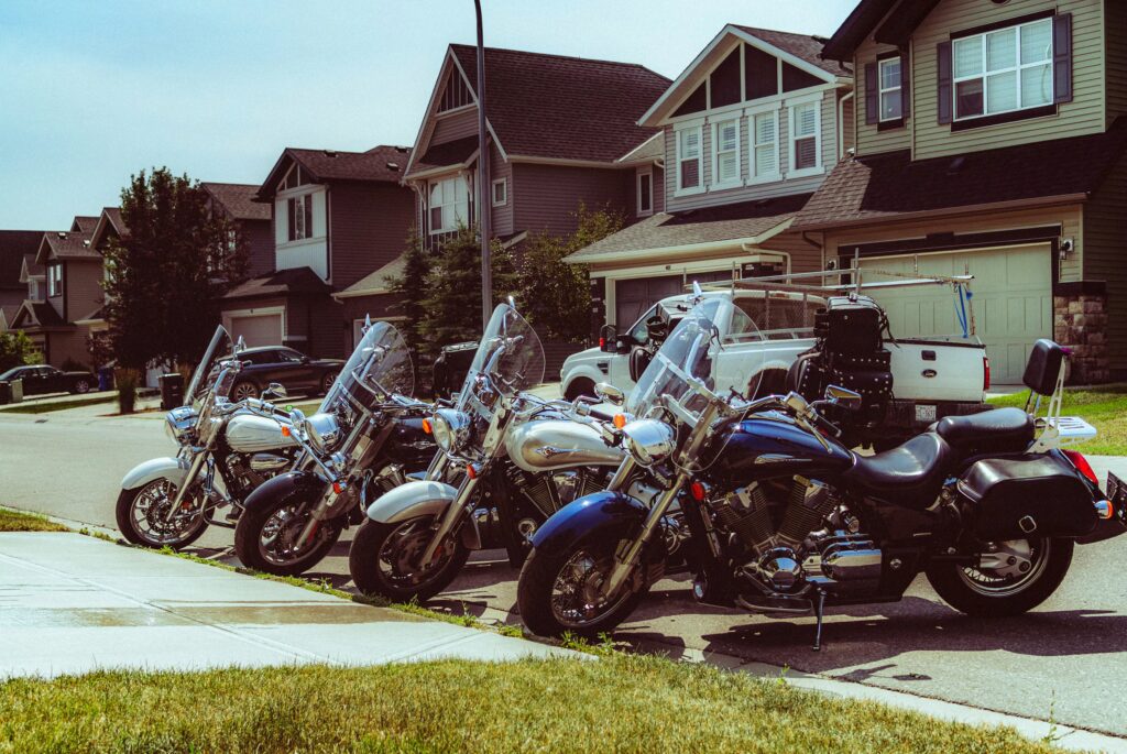 Cruiser motorcycles parked in residential Houston neighborhood